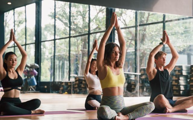 Women in the gym practising yoga